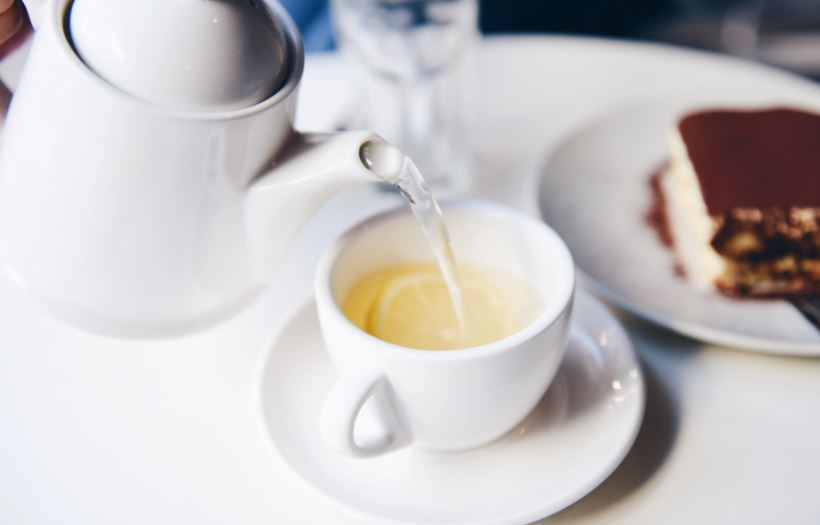 Hot water being poured into a tea cup